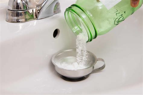 Vinegar baking soda drain - Allow your sink to drain completely. This may take time, but it will eventually clear. Pour 1/4-cup of baking soda into your drain. You can use a funnel to make sure all of the baking soda goes down the drain. Add 1 1/4 cup of white vinegar to the drain using the same funnel. Use a sink stopper to plug the drain.